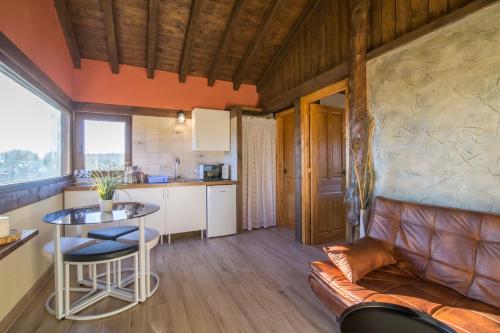 a living room with a couch and a table at El BURGO DE OSMA ALOJAMIENTO RURAL VILLA BAGH in El Burgo de Osma