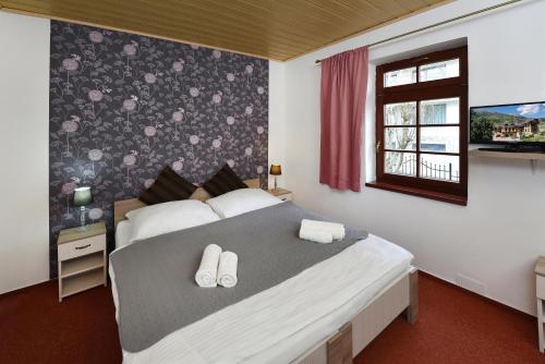 מיטה או מיטות בחדר ב-Pension Villa Kunerad