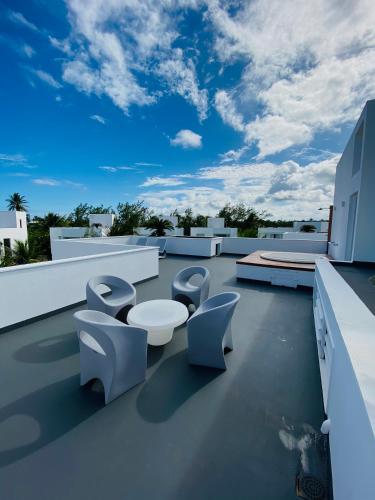 a balcony with toilets on the roof of a building at B Blue Beachouses in Itacimirim