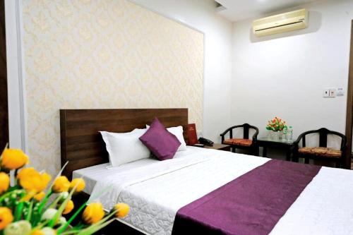 Un ou plusieurs lits dans un hébergement de l'établissement Van Giang Hotel