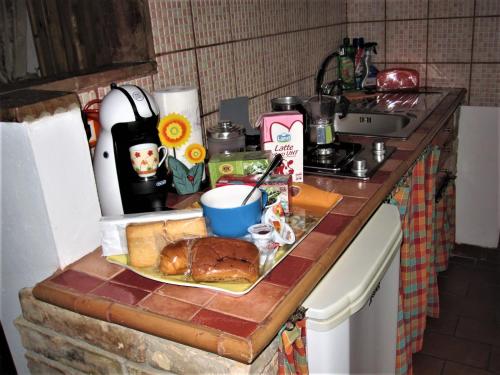 a plate of food on a counter in a kitchen at La Pietra Rara B&B in Montone
