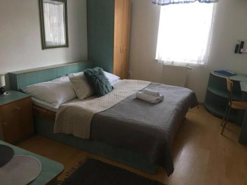 Postel nebo postele na pokoji v ubytování Guest House Maxim