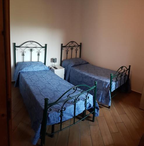 Llit o llits en una habitació de Locanda Dl'Angel