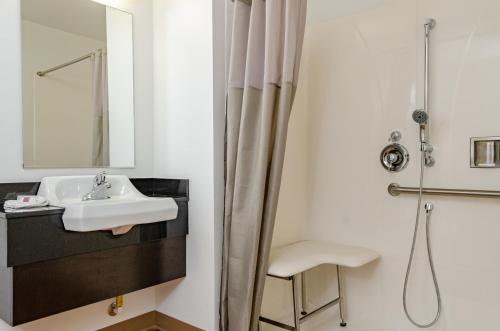 a bathroom with a sink and a mirror at Motel 6-Livingston, CA - Merced County in Livingston