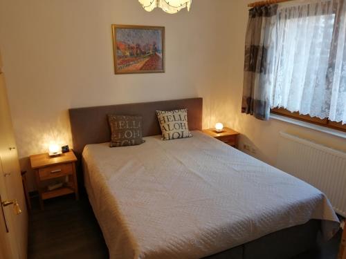 a bedroom with a bed with two pillows on it at Ferienwohnung Törpsch in Pirna