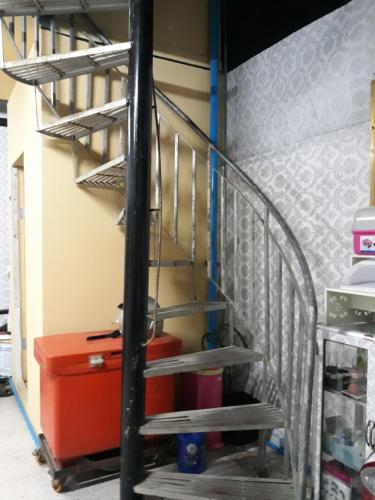 a stairway in a room with a suitcase at Vanny's Peaceful Guesthouse in Phnom Penh