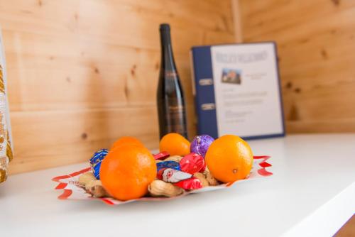 a pile of fruit sitting on top of a table at Haus Miranda Grächen in Grächen