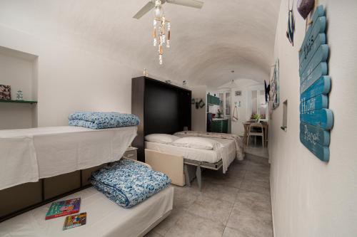 A bed or beds in a room at La Magnolia, Caressa de mä