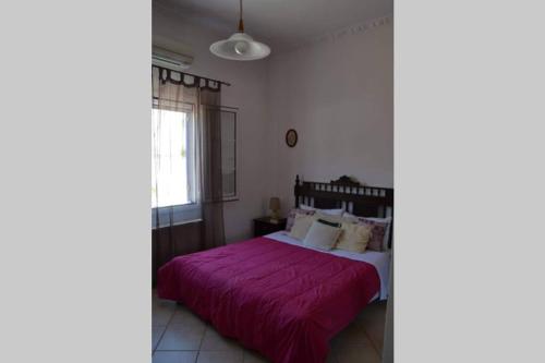 Ένα ή περισσότερα κρεβάτια σε δωμάτιο στο Aegina House