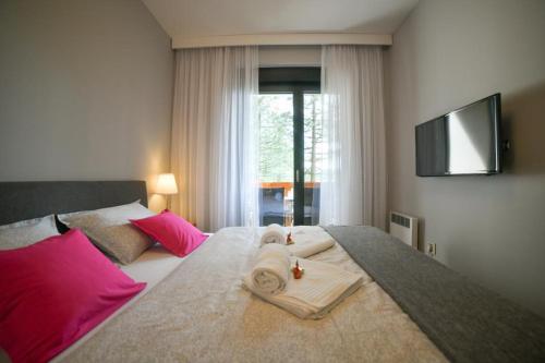 Ein Bett oder Betten in einem Zimmer der Unterkunft Apartman Silver Lux