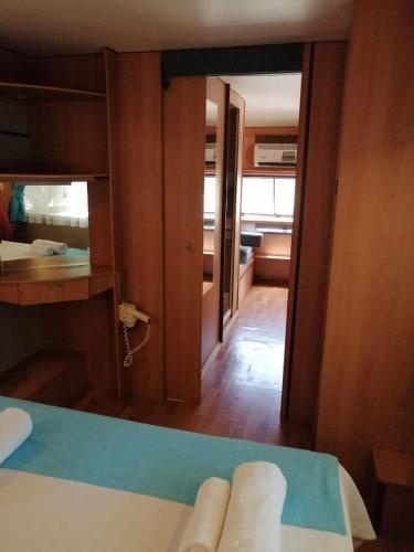 a room with a bed and a mirror and a bedroom at Kara Kedi Beach Bungalow in Cıralı