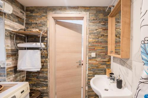 a bathroom with a toilet and a sink at Stone House Knez in Vrbnik