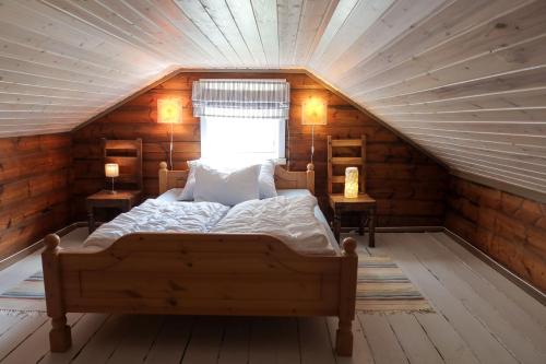 Tempat tidur dalam kamar di Det Hvite Hus