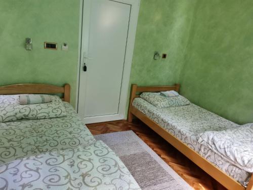 Postel nebo postele na pokoji v ubytování Guest Accommodation Azucki