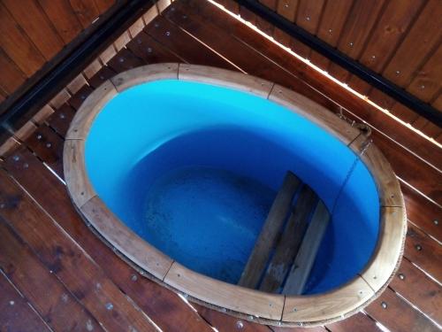 an overhead view of a blue bowl in a wooden building at Rukavychka in Yaremche