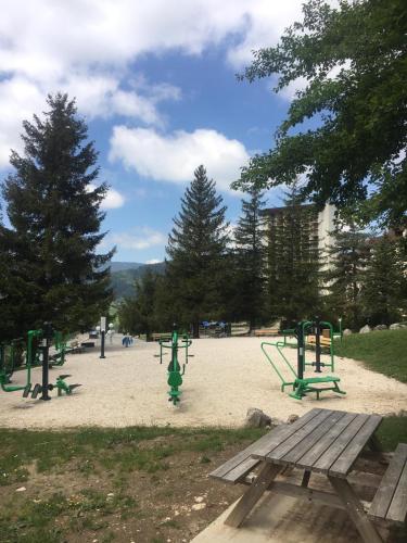 a park with a picnic table and a playground at La Grande Moucherolle bis in Villard-de-Lans
