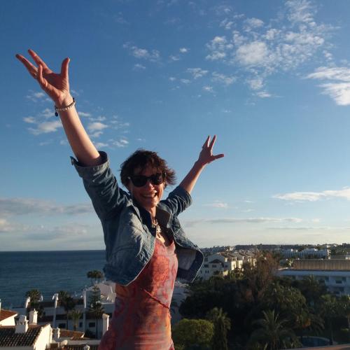 a woman with her arms in the air with her hands in the sky at Maison de La Beslière meublé de tourisme 2 étoiles in Folligny