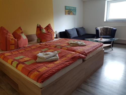 En eller flere senge i et værelse på Ferienwohnung Rixen