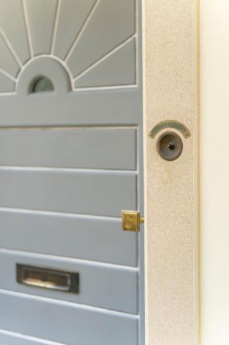 a white door with a knob on it at Haus im Schlossergässchen in Baden