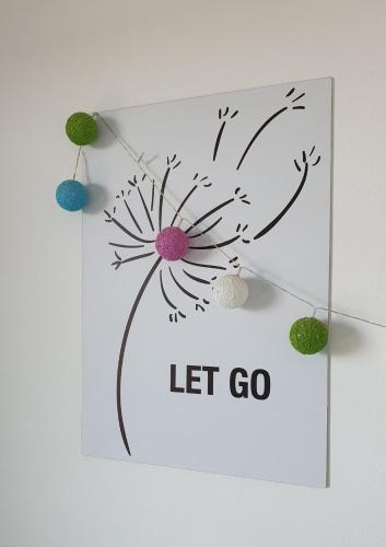 a picture of a flower with the words let go at Ammunaini in Punta Del Diablo