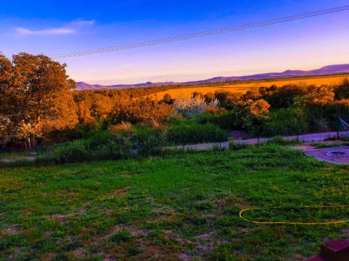 a view of a field with a yellow hose at Dva Duby in Nána