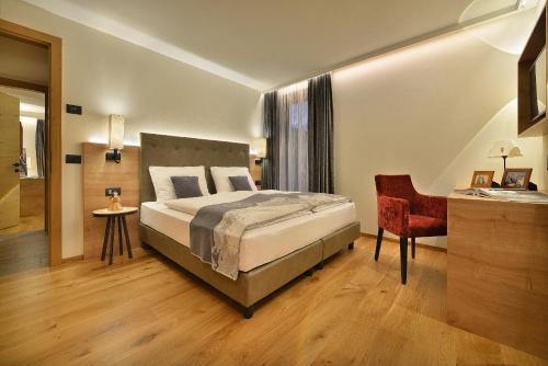 En eller flere senge i et værelse på Roberta Loft - rooms and apartments