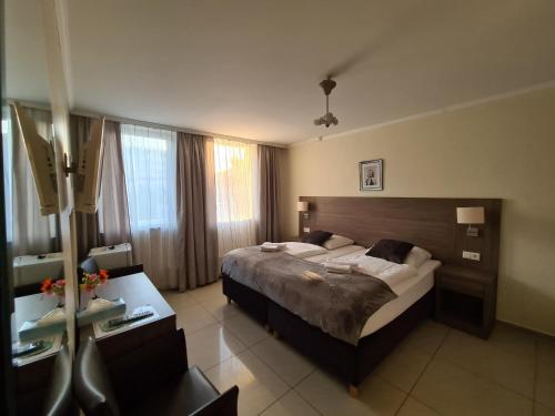 Postel nebo postele na pokoji v ubytování Hotel Cara Vita Cologne