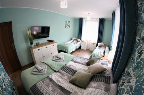 Giường trong phòng chung tại Apartamenty Zielone Centrum