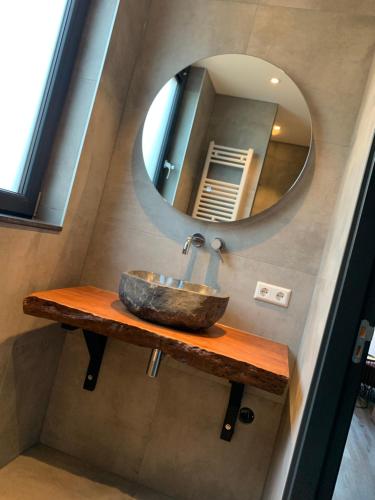 a bathroom with a sink and a mirror at The Rock in Zandvoort