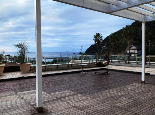 a balcony with a view of the ocean at Nishiizu Crystal View Hotel in Nishiizu