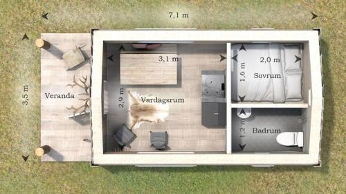 a floor plan of a small house with a dog on it at Lycka in Torestorp