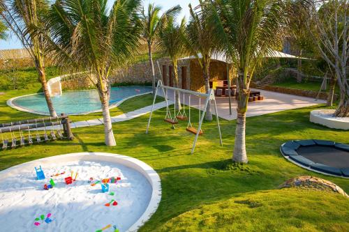 an aerial view of a playground in a resort at Fusion Resort Cam Ranh - All Spa Inclusive in Cam Ranh
