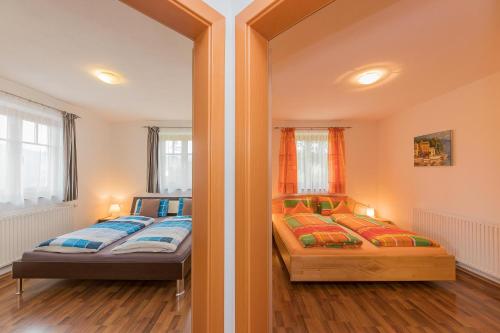 Postel nebo postele na pokoji v ubytování Landhaus Hochkönig