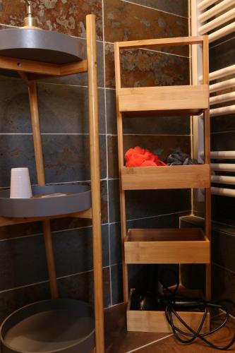 a room with wooden shelves in a bathroom at Ilot Désille in Boulogne-sur-Mer