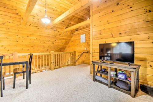 a living room with a large flat screen tv in a cabin at Cozy Winter Retreat Great Location and Pet Friendly in New Market