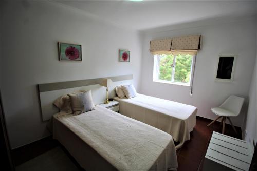 Postel nebo postele na pokoji v ubytování T1 Alvor/ Prainha