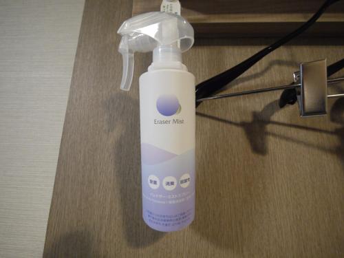 a bottle of feed me liquid sitting on a table at Hotel Route-Inn Aomori Ekimae in Aomori