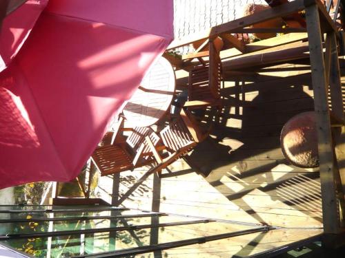 a group of chairs and an umbrella on a slide at Guesthouse in Picture in Jeonju