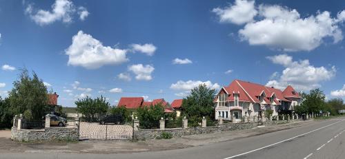 a row of houses on the side of a road at Beregynya in Yuzhnoukrainsk 