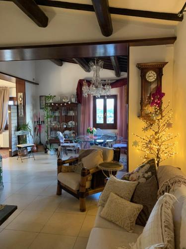 a living room with couches and a dining room at B&B L'Orologio in Signa