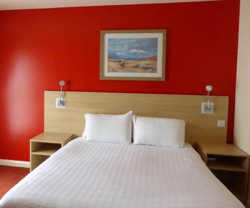 The Welcome Inn Rotherham/Sheffieldにあるベッド