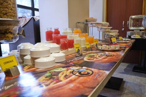 a table with a bunch of food on it at The Samilton in Kolkata