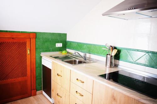 a kitchen with a sink and a counter top at El Ático de La Casa Viva in Vélez Blanco