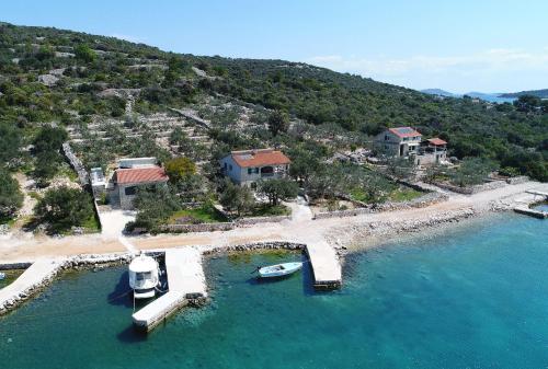 an aerial view of an island with boats in the water at House Dino in Tkon