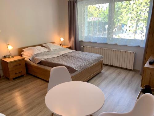 Posteľ alebo postele v izbe v ubytovaní Portowa 35