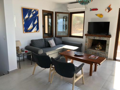 a living room with a couch and a table at Boutique Family Villa in Monastiraki