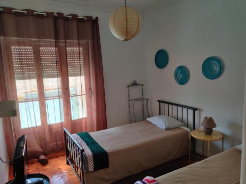 Postel nebo postele na pokoji v ubytování Vasco Santana Guesthouse
