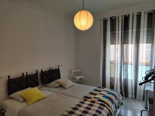 Postel nebo postele na pokoji v ubytování Vasco Santana Guesthouse