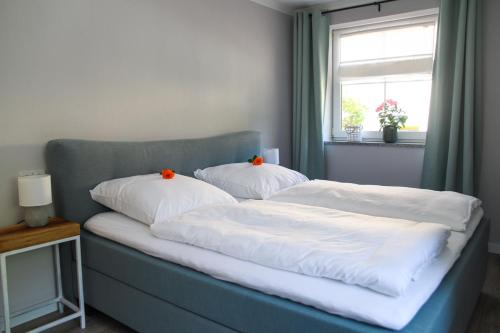 Кровать или кровати в номере Ferienwohnung Julia