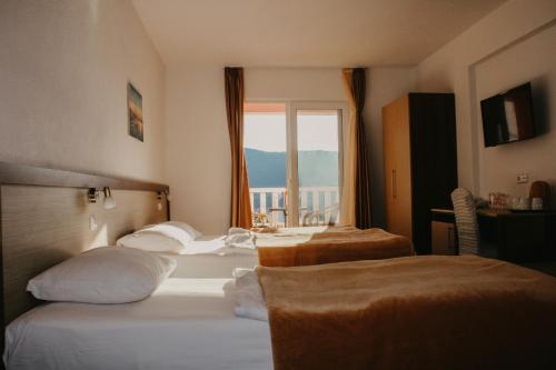 Ένα ή περισσότερα κρεβάτια σε δωμάτιο στο Hotel Villa Matic